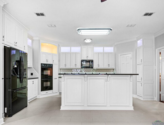 5908 Regents Row, Tyler, TX 75703 - kitchen featuring black appliances, dark countertops, decorative backsplash, white cabinets, and ornamental molding