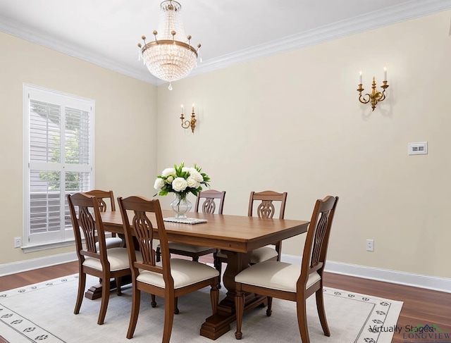 5908 Regents Row, Tyler, TX 75703 - dining space featuring a chandelier, crown molding, wood finished floors, and baseboards