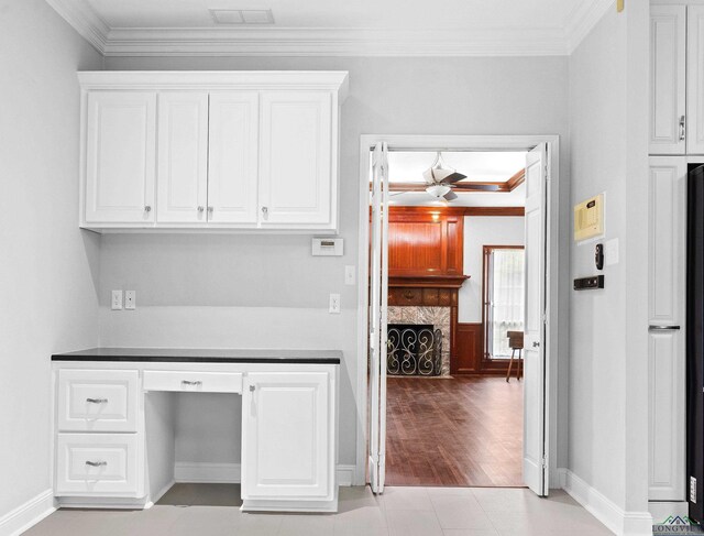 5908 Regents Row, Tyler, TX 75703 - unfurnished office featuring a ceiling fan, ornamental molding, a fireplace, and baseboards