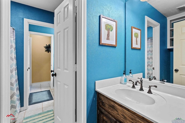 bathroom with vanity and tile patterned flooring