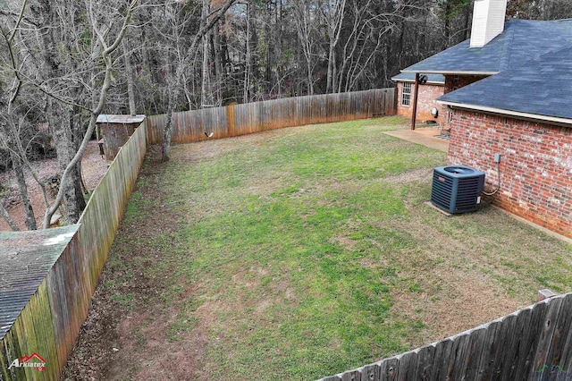 view of yard with a patio and central AC