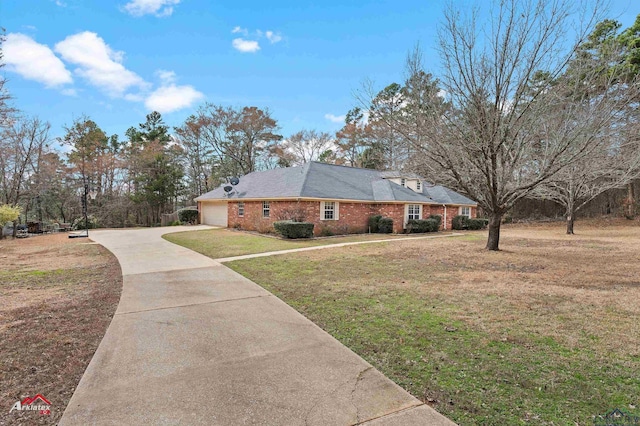 view of property exterior featuring a garage and a lawn