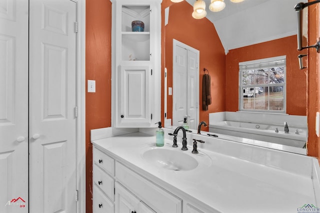 bathroom featuring vanity and vaulted ceiling