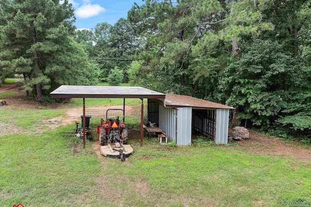 4501 Fm 1650, Gilmer, TX 75645 - view of green lawn with a pole building, an outbuilding, and a detached carport
