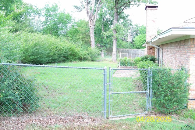 view of yard with a gate and fence