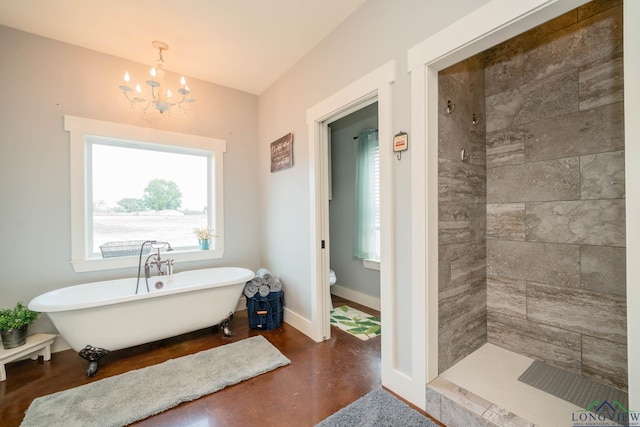 bathroom featuring a notable chandelier, toilet, and plus walk in shower