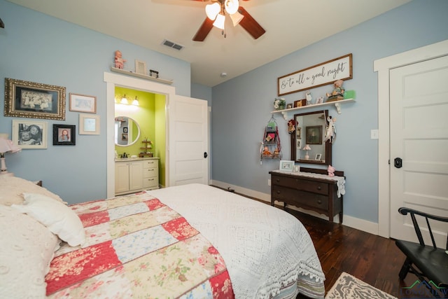 bedroom with ensuite bath, ceiling fan, and dark hardwood / wood-style flooring