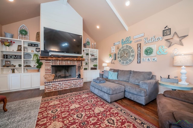 living room with a fireplace, dark hardwood / wood-style flooring, and high vaulted ceiling