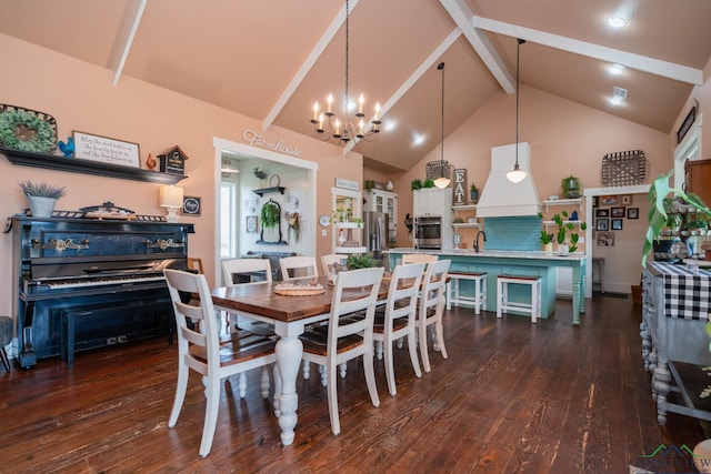 dining space with vaulted ceiling with beams, dark hardwood / wood-style flooring, a chandelier, and sink