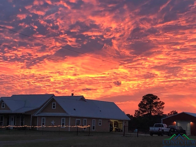 view of back house at dusk