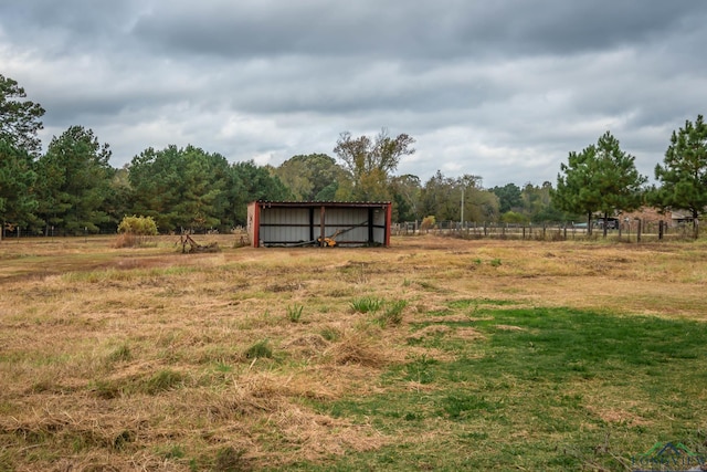 view of yard with a rural view