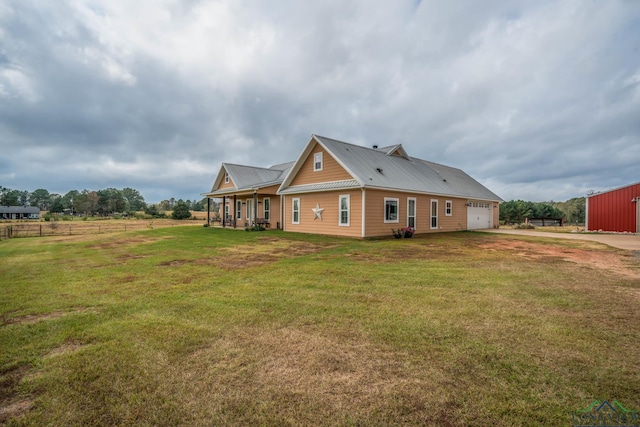 back of house with a lawn and a porch