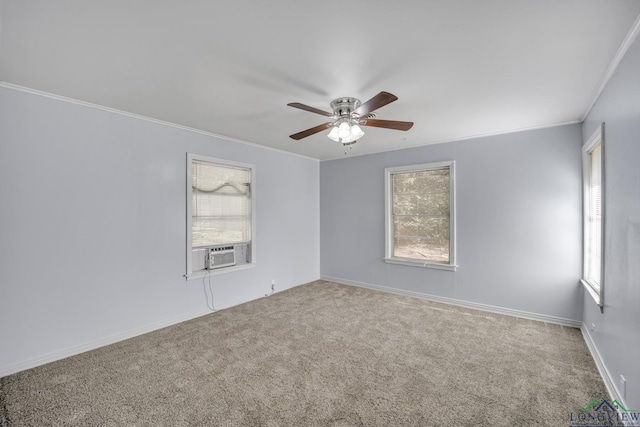 empty room with carpet floors, cooling unit, ceiling fan, and crown molding