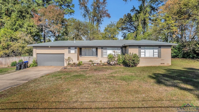 ranch-style home with a front lawn and a garage