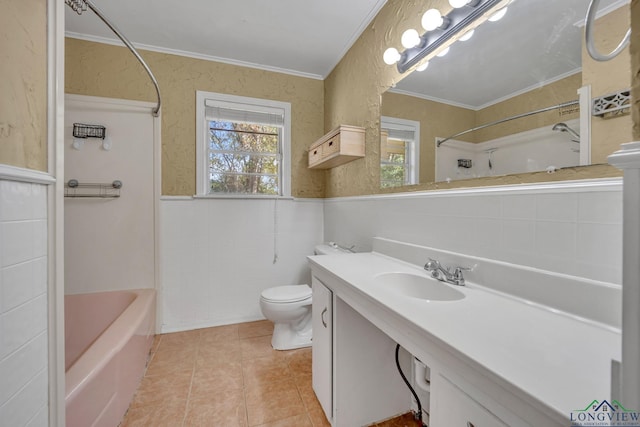 bathroom with tile patterned floors, toilet, crown molding, and sink