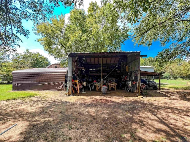 8227 N Kings Hwy, Texarkana, TX 75503 - view of pole building with a detached carport