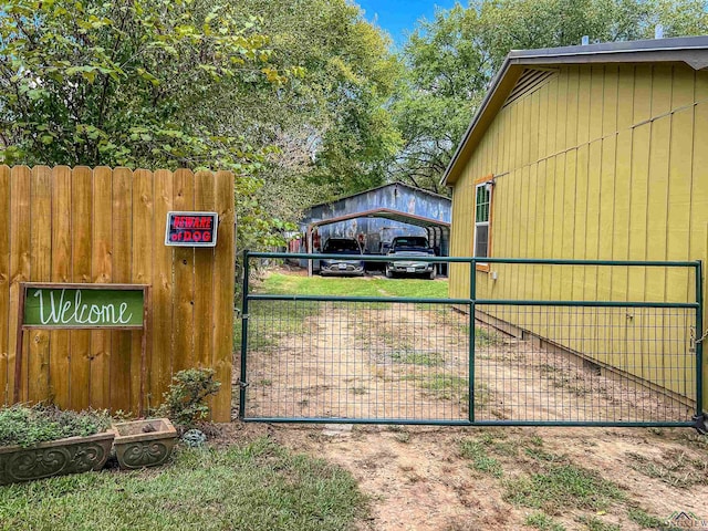 8227 N Kings Hwy, Texarkana, TX 75503 - view of property exterior featuring a gate