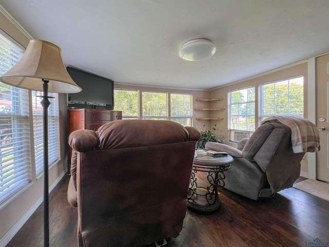 8227 N Kings Hwy, Texarkana, TX 75503 - living room featuring wood finished floors, ornamental molding, and healthy amount of natural light