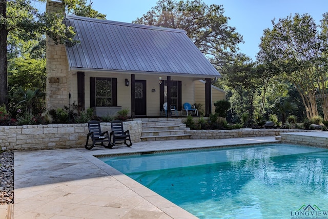 view of swimming pool featuring a patio area