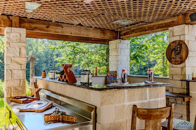 view of patio / terrace featuring an outdoor bar