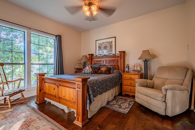 bedroom featuring dark hardwood / wood-style flooring and ceiling fan