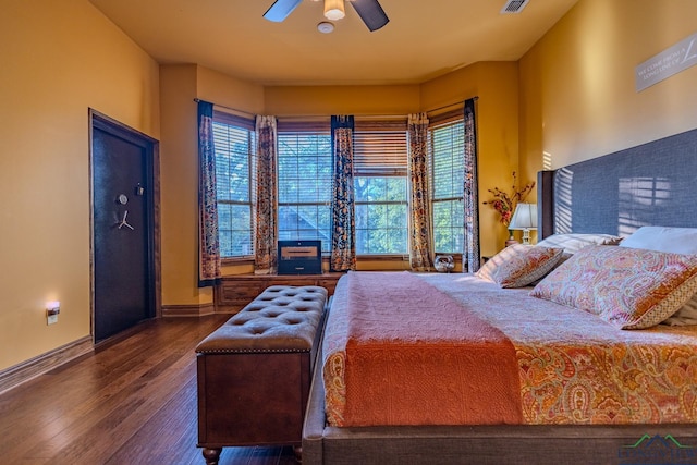 bedroom featuring ceiling fan and dark hardwood / wood-style floors