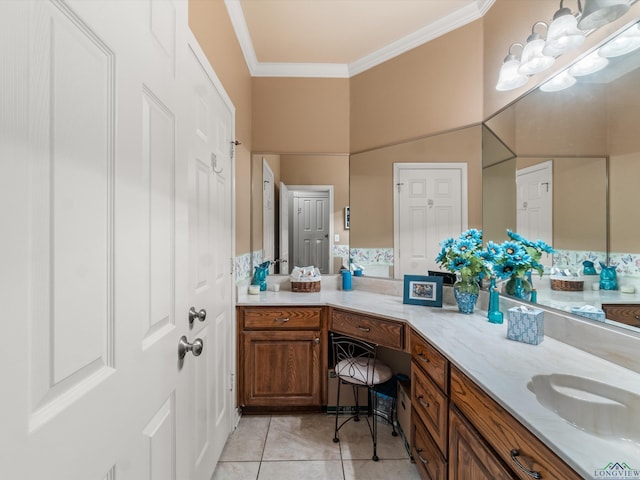 bathroom with tile patterned flooring, vanity, and crown molding