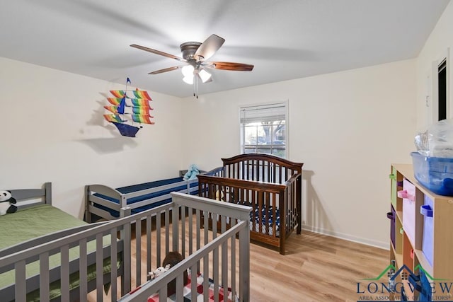 bedroom featuring ceiling fan and light hardwood / wood-style flooring