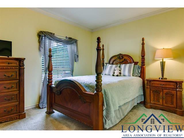 1018 Brown Dr, Texarkana, TX 75501 - carpeted bedroom with ornamental molding and baseboards