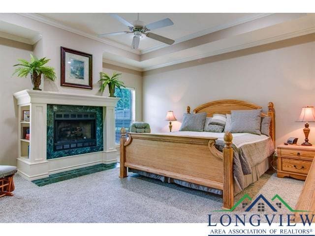 1018 Brown Dr, Texarkana, TX 75501 - bedroom featuring crown molding, a premium fireplace, carpet flooring, and a ceiling fan