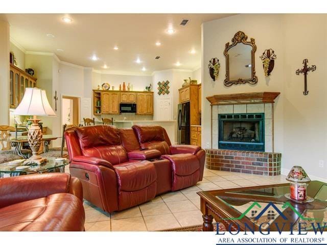 1018 Brown Dr, Texarkana, TX 75501 - living area featuring a fireplace, light tile patterned flooring, and crown molding
