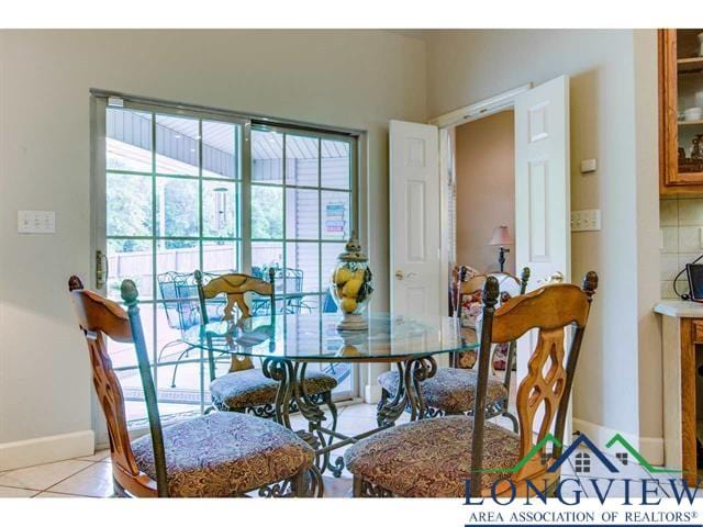 1018 Brown Dr, Texarkana, TX 75501 - dining room featuring baseboards and light tile patterned floors