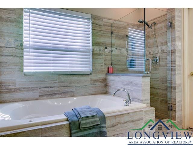1018 Brown Dr, Texarkana, TX 75501 - bathroom with a shower stall and a bath