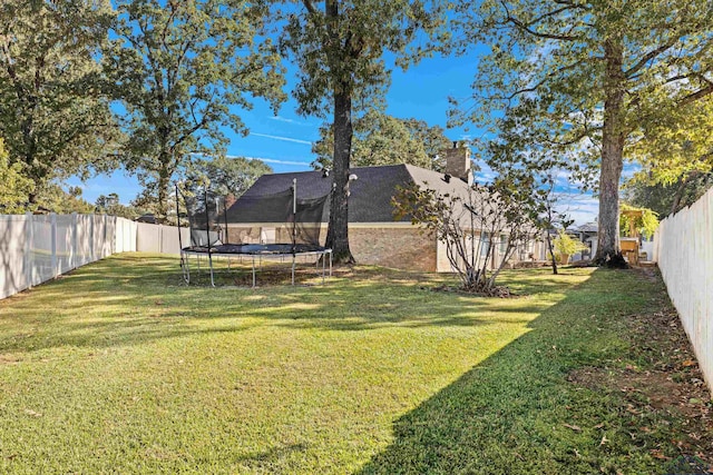 view of yard featuring a trampoline