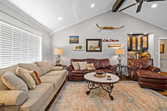 living room with vaulted ceiling with beams, ceiling fan, hardwood / wood-style flooring, and ornamental molding