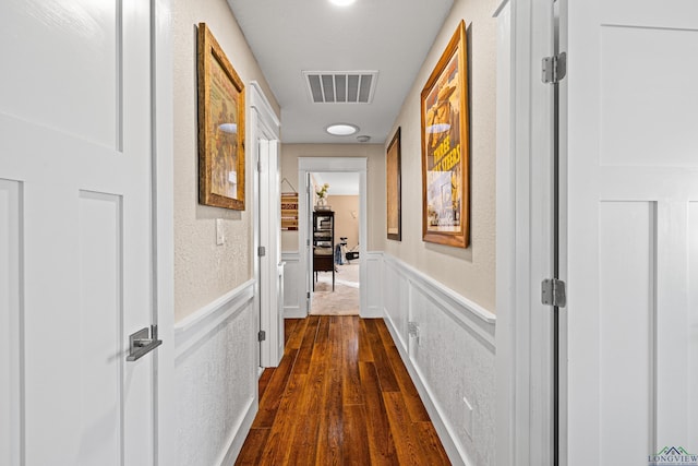 hall featuring dark wood-type flooring