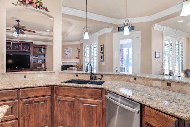 kitchen with brown cabinetry, open floor plan, dishwasher, and a sink