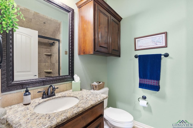 full bath featuring toilet, walk in shower, and vanity