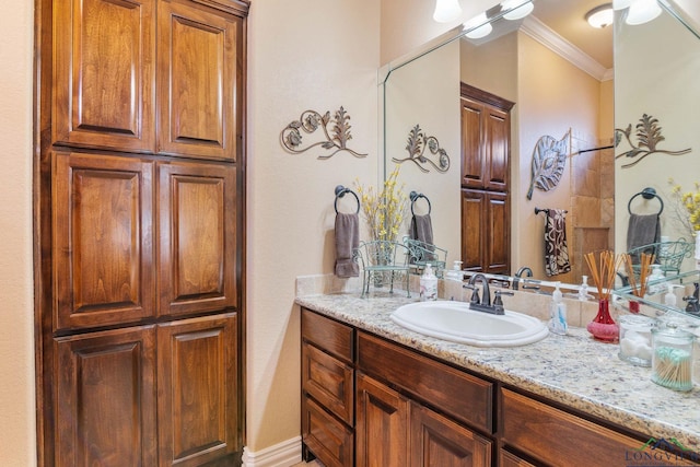 bathroom with vanity and crown molding