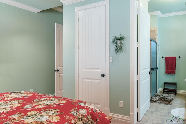 bedroom with ornamental molding and baseboards