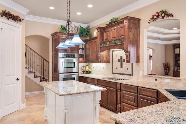 kitchen with stainless steel double oven, light stone countertops, hanging light fixtures, decorative backsplash, and crown molding