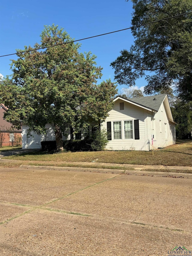 view of property exterior featuring a yard