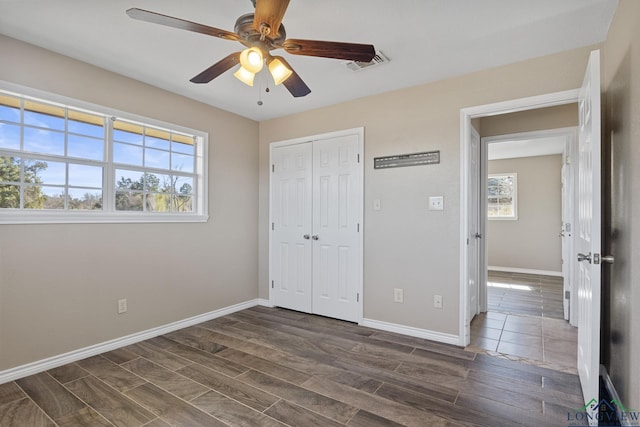 unfurnished bedroom featuring a closet and ceiling fan