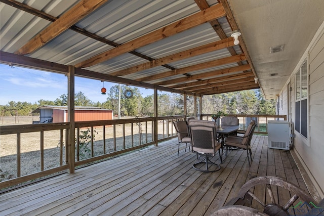 wooden terrace with a hot tub