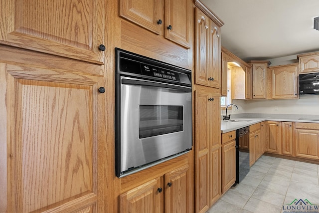 kitchen with sink, black dishwasher, oven, and cooktop