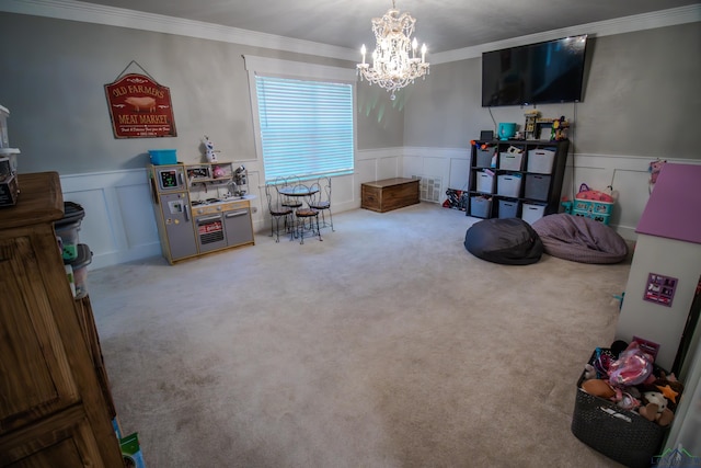 playroom with ornamental molding, carpet, and wainscoting