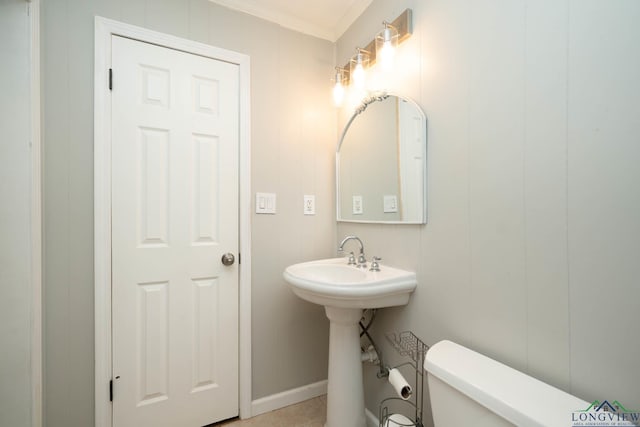 169 Hidden Frst, Longview, TX 75605 - half bath featuring toilet, crown molding, tile patterned floors, and a sink