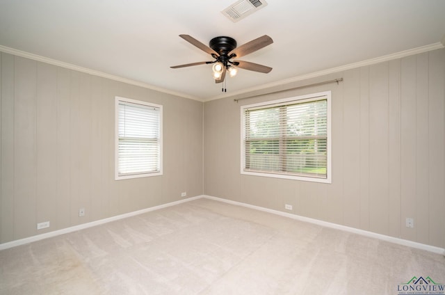 169 Hidden Frst, Longview, TX 75605 - unfurnished room with crown molding, ceiling fan, plenty of natural light, light colored carpet, and baseboards