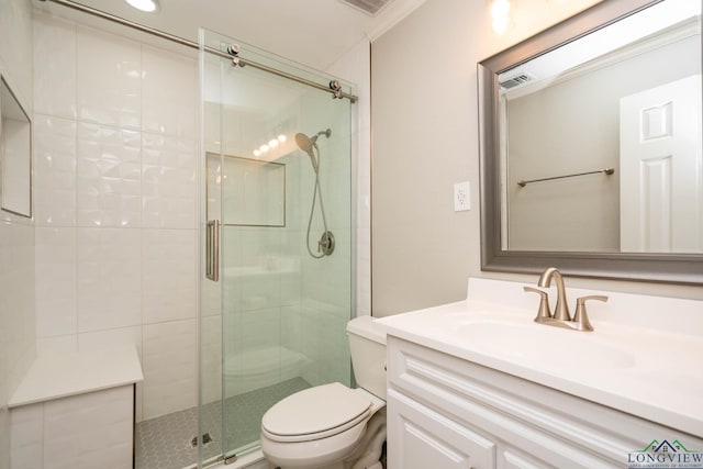 169 Hidden Frst, Longview, TX 75605 - full bathroom featuring toilet, a stall shower, vanity, and crown molding