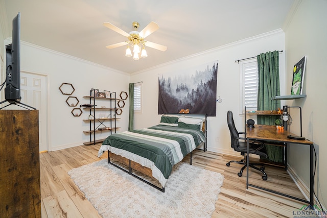 bedroom featuring light wood-type flooring, baseboards, and ornamental molding